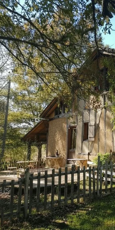 Side wing of the main house beneath the trees