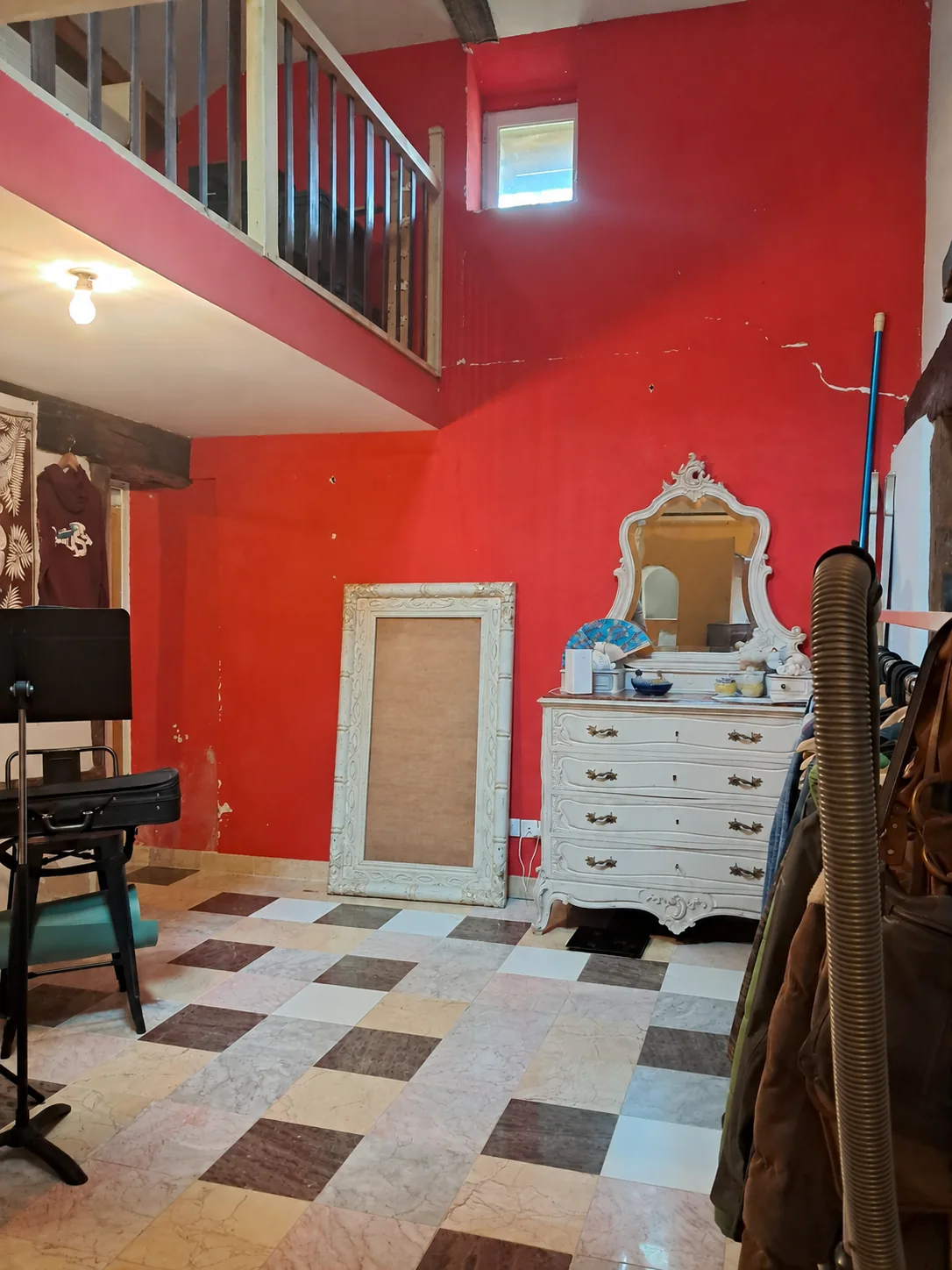 Red room and mezzanine before refurbishment, with the people removed